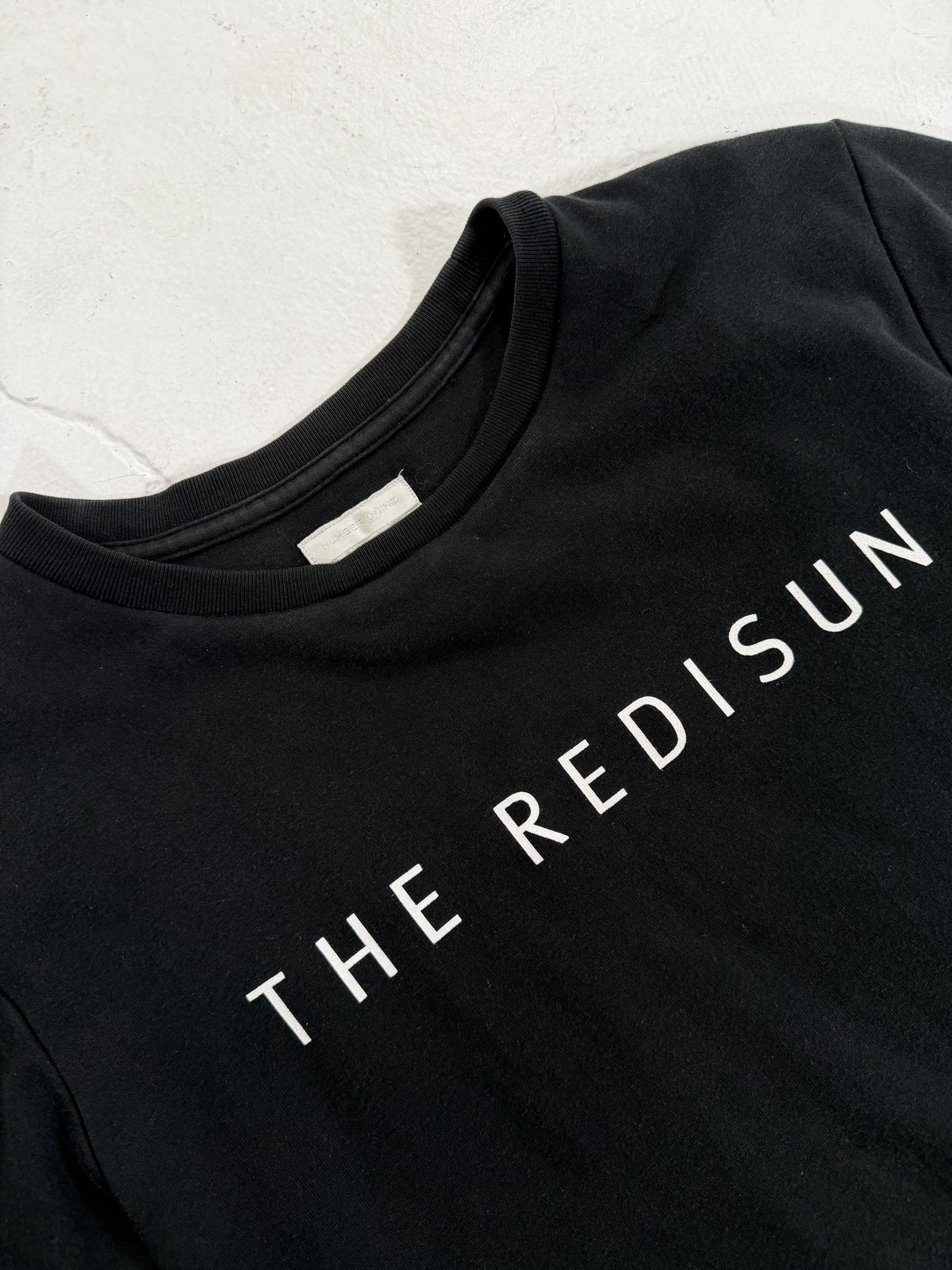 Number (N)ine "the redisun" tee {{ color }} {{ brand }} {{ archive }} {{ season }} {{ year }} {{ hedi slimane }}