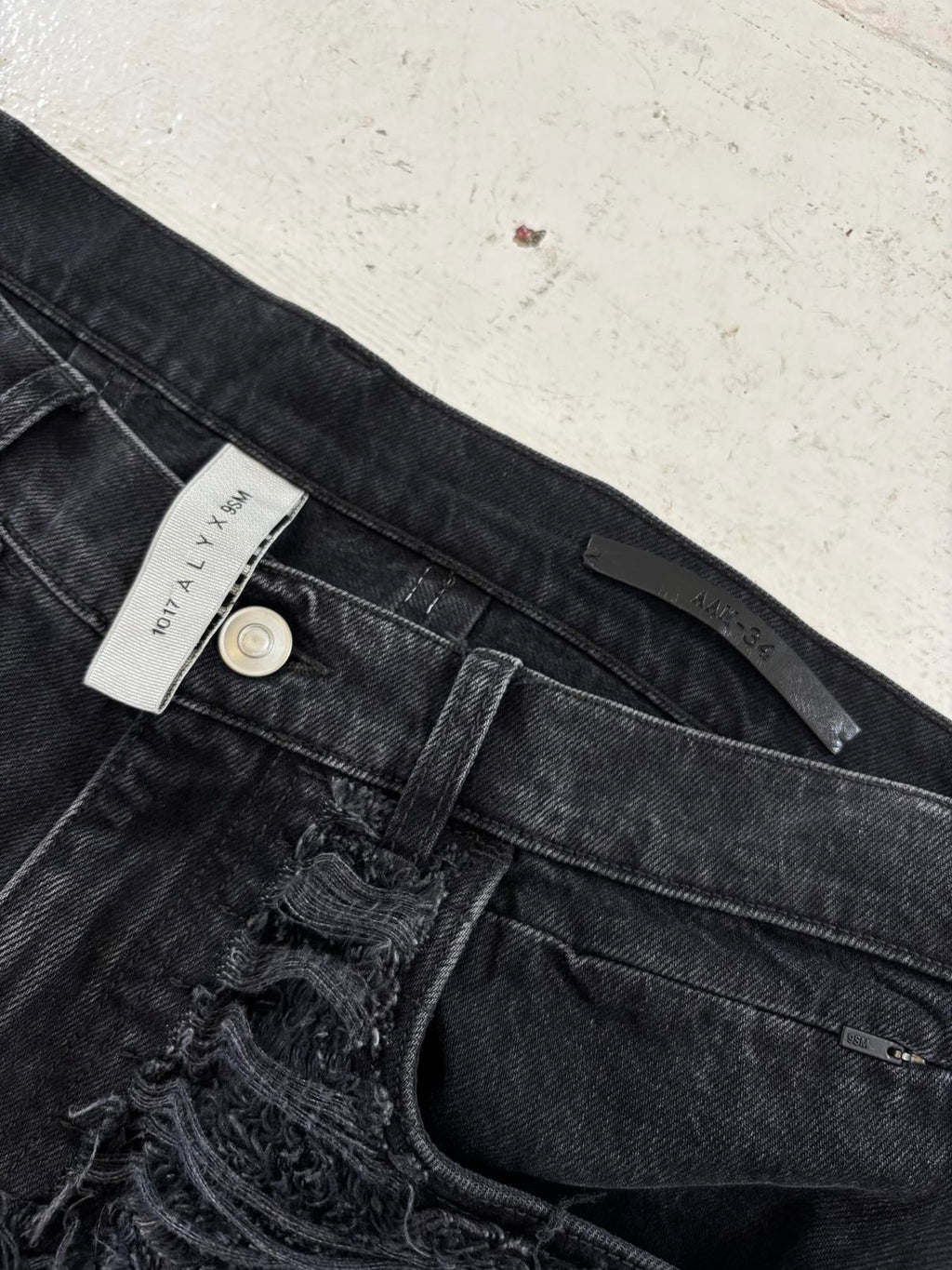 1017 Alyx x BlackMeans distressed denim