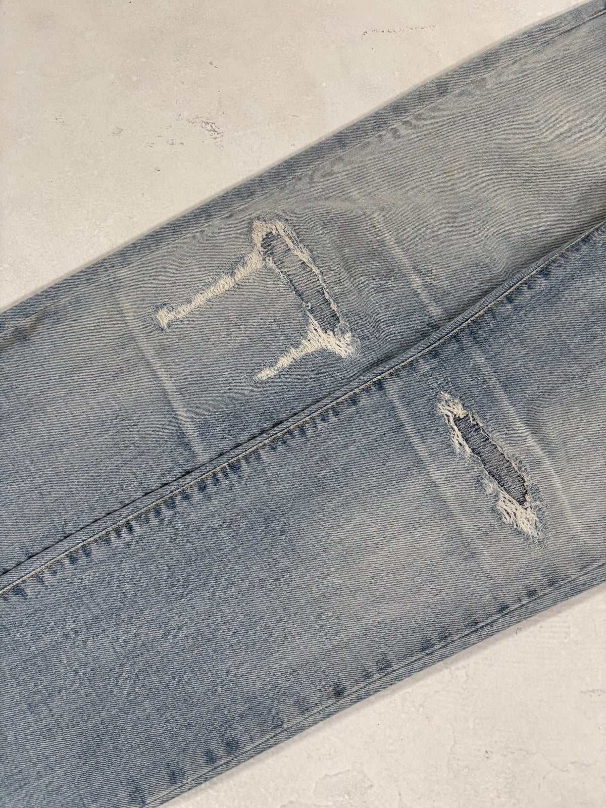 Saint Laurent Paris Light Blue Repaired Denim {{ color }} {{ brand }} {{ archive }} {{ season }} {{ year }} {{ hedi slimane }}