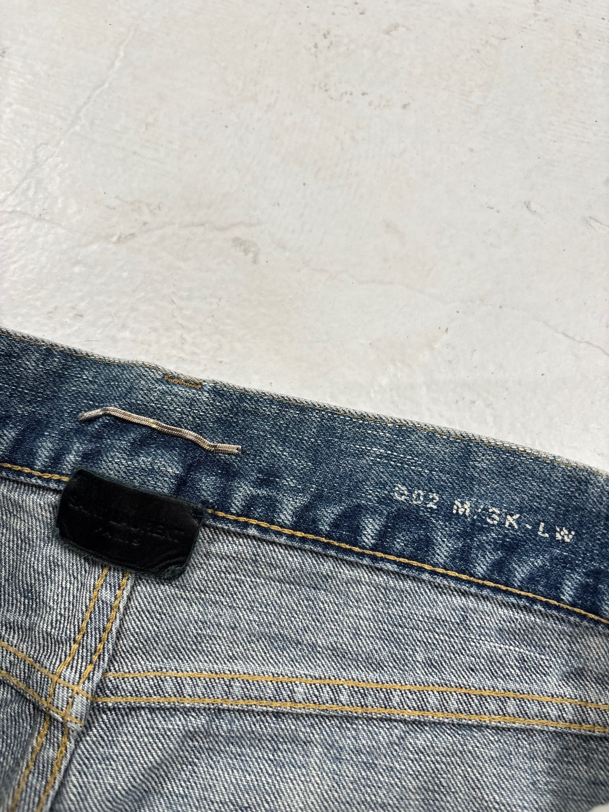 Saint Laurent Paris D02 Repaired Denim {{ color }} {{ brand }} {{ archive }} {{ season }} {{ year }} {{ hedi slimane }}